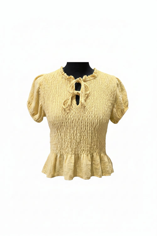 Blusa nidos amarilla mantequilla